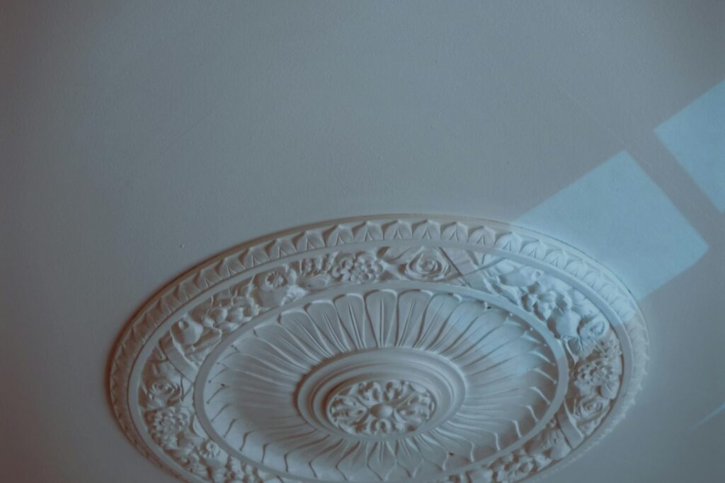 Victorian ceiling rose painting tips: close-up of a carved decorative ceiling medallion